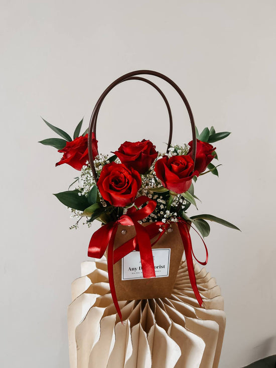 Red Roses bloom bag with baby breathe and ruscus. perfect for valentines day