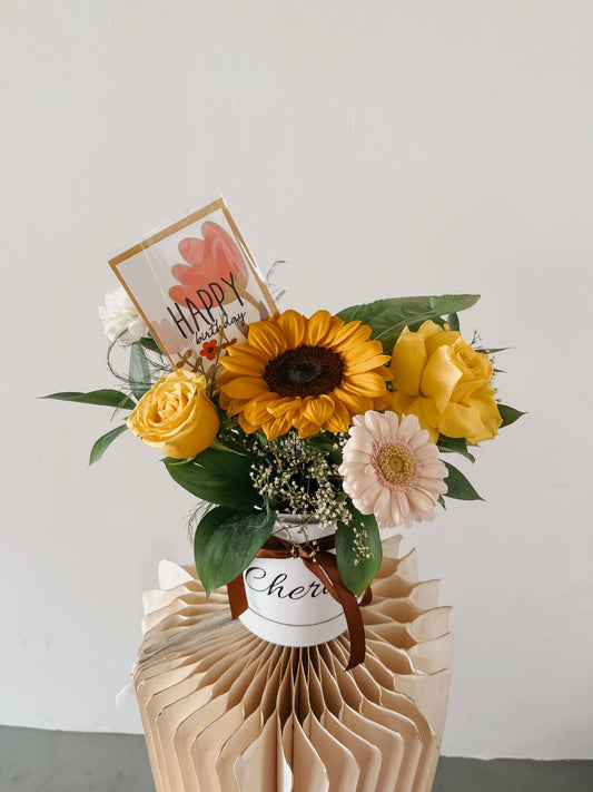Any Day FloristThe sunflower symbolizes unwavering faith and unconditional love. It's perfect to send to your loved one if you want to show them how much you care. It's common to sSunny Bloom Box |Fresh Bouquet