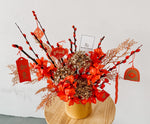 Chinese new year home decor with red and gold artificial flowers