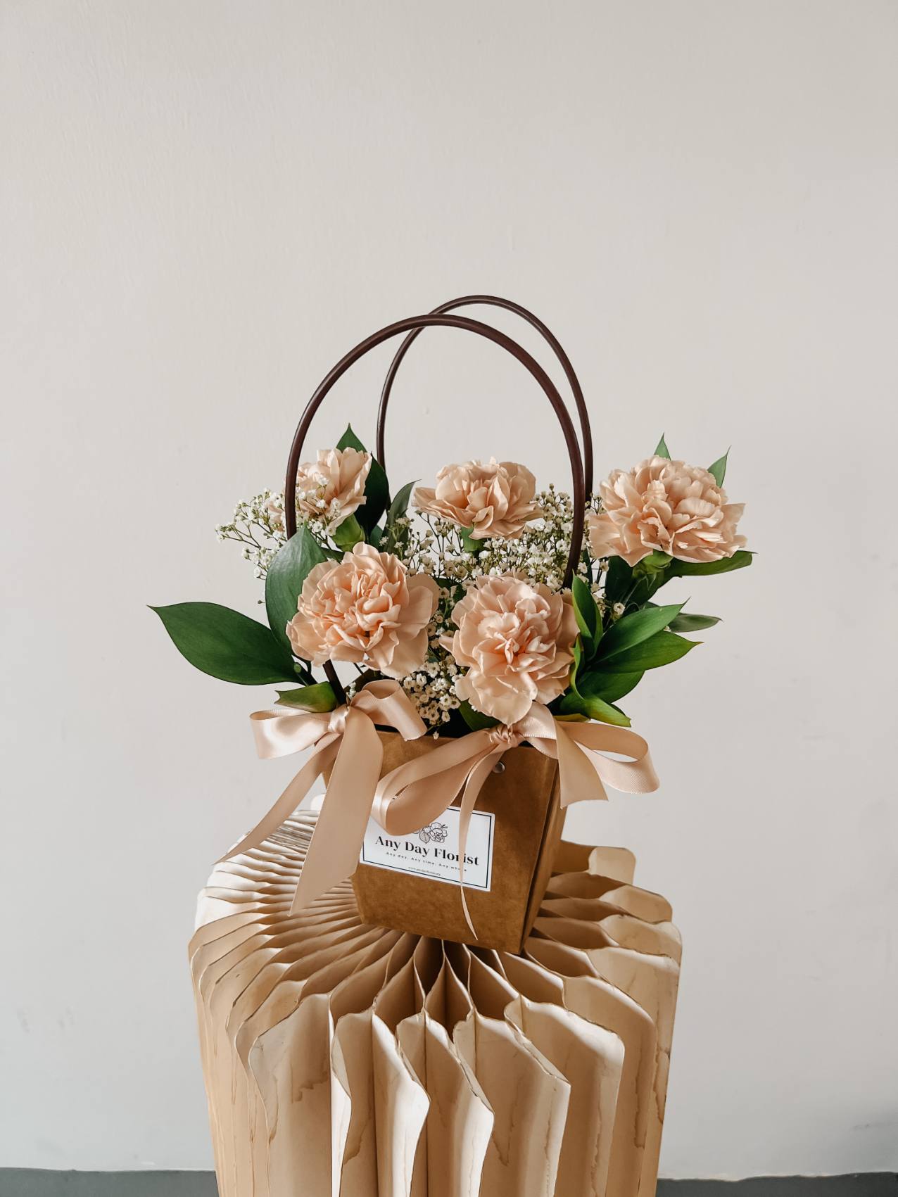 Any Day FloristPerfect Ocassion for: Birthday, Mother's Day, Monthsary.
*Do note that fresh flowers, fillers &amp; foliage are seasonal and are subjected to changes based on availaChampagne | Carnation Bloom Bag