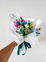 Any Day FloristProduct Description
A colorful and unique bouquet of rainbow tulips will soon become the centerpiece of any special occasion. Try your hand at being creative with thRainbow Tulip Bouquet