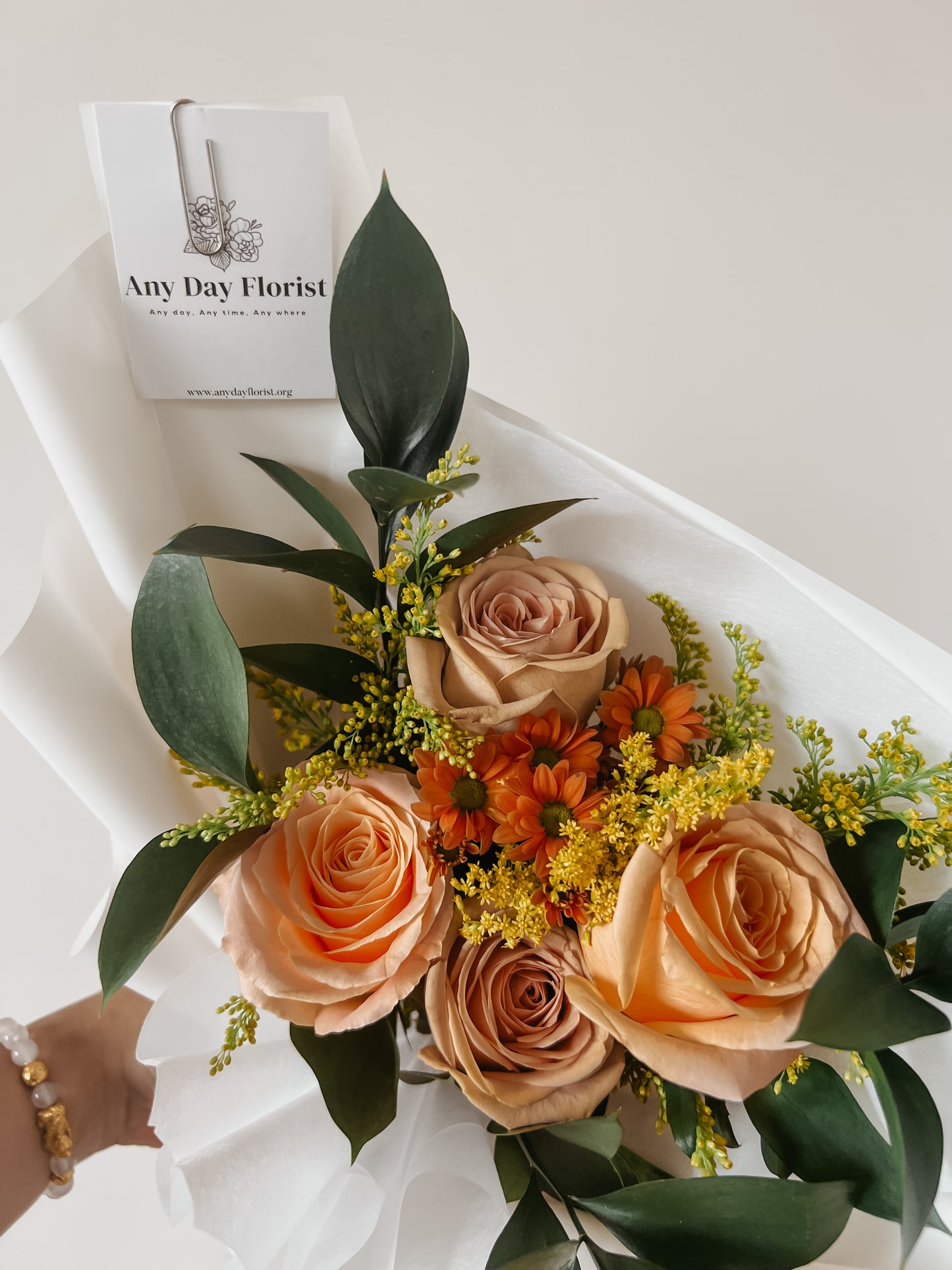 Any Day FloristProduct Description
The perfect way to say thank you to a friend or loved one, this shimmering and colorful arrangement of cappuccino roses is an elegant gift that wCappuccino Shimmer Bouquet