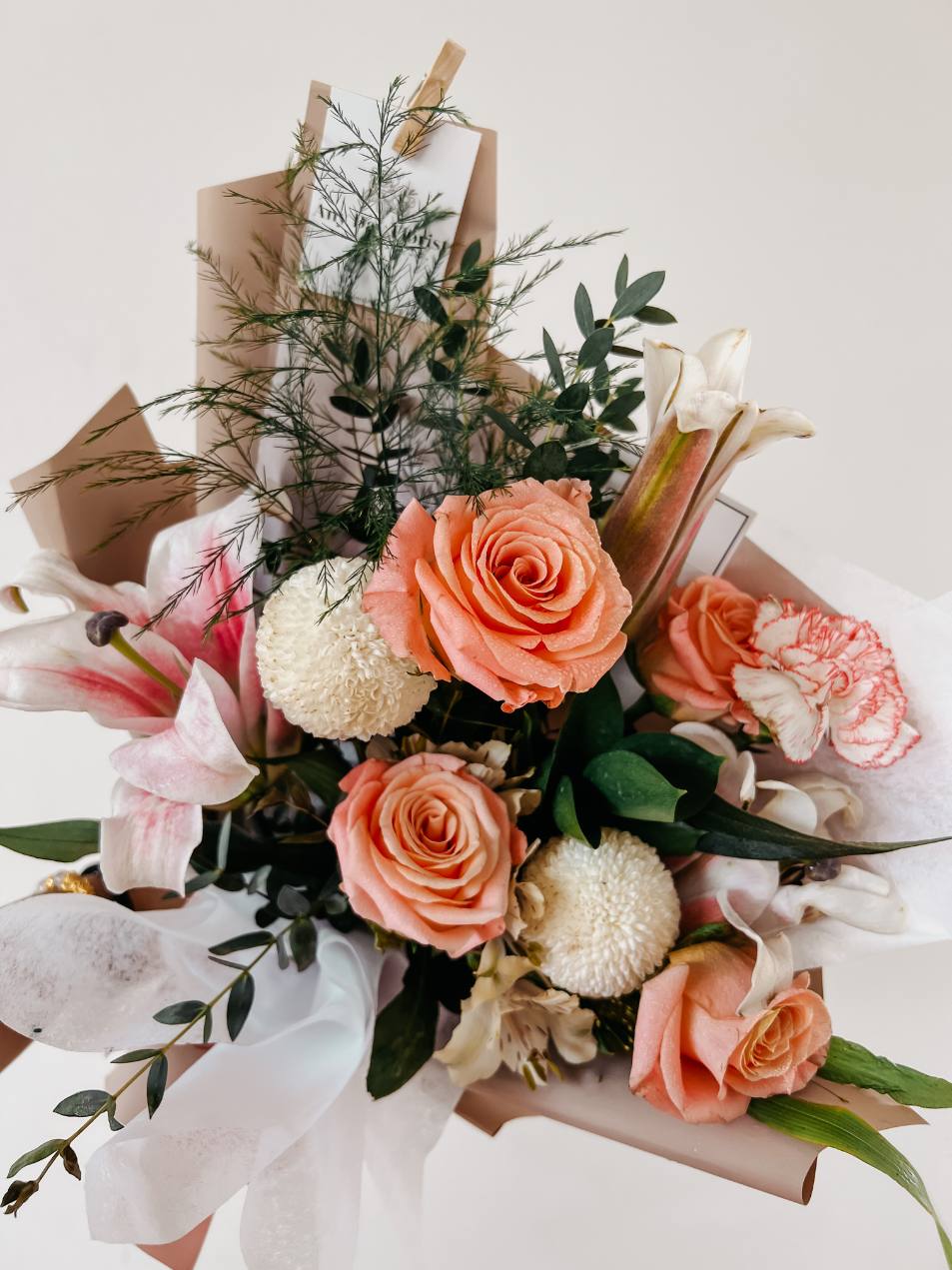 Any Day FloristBeautiful combinations of lilies from holland and garden roses perfect gift for all the mothers out there!
*Please note that our selection of flowers may differ sligLilian Rosie | Shimmer Coral Roses with Lilies
