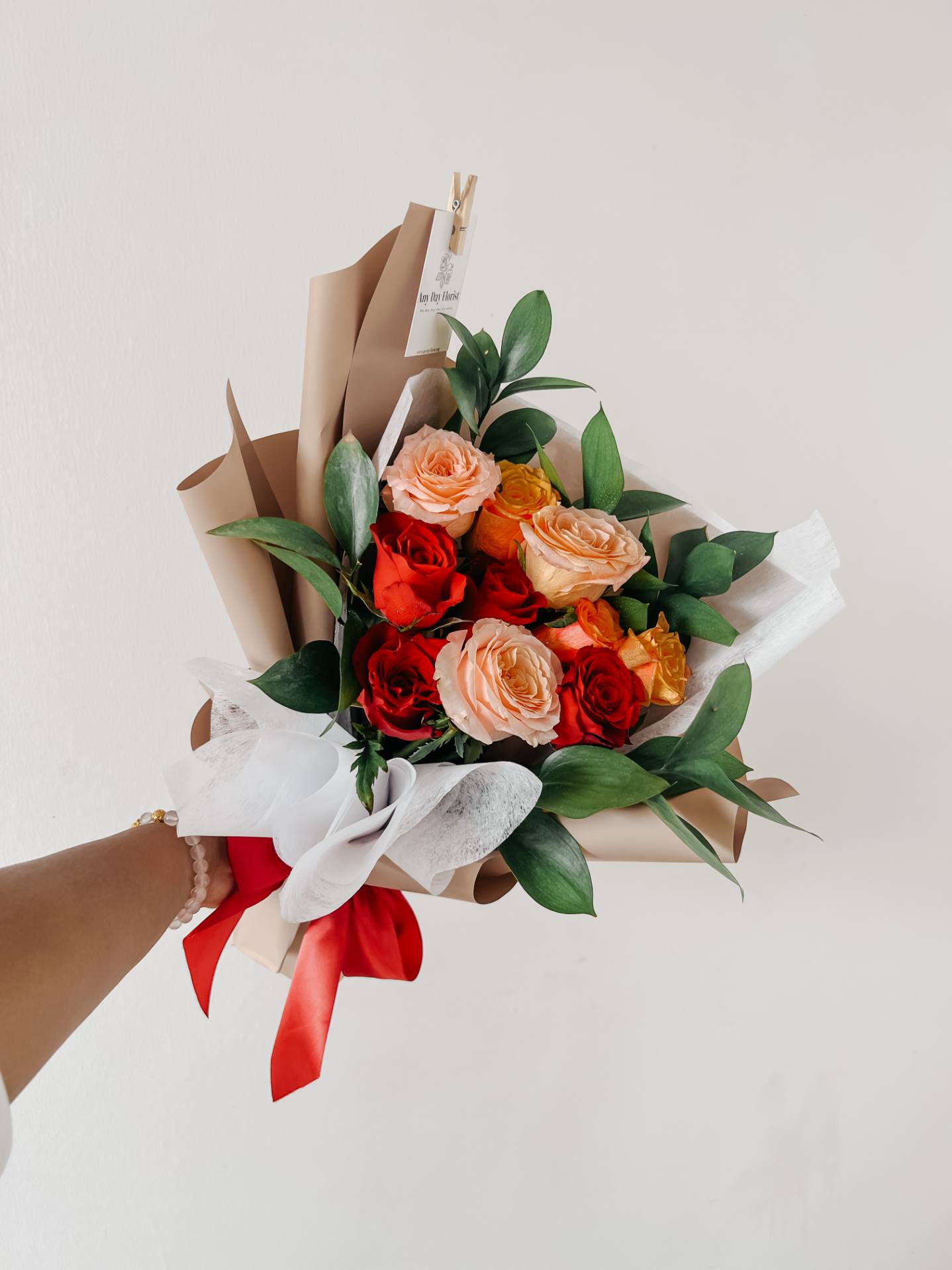 Any Day FloristBouquet inspired for the love you met in summer! With a beautiful combination of orange, red, champagne roses bringing back the day you've met in summer... Such a roSummer love | Roses Bouquet