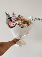 Any Day FloristThe XL Hand bouquet of the day flower is selected from a mixture of flowers that are freshest and in season. The florist chooses different flowers daily to create a Hand Bouquet of the Day XL