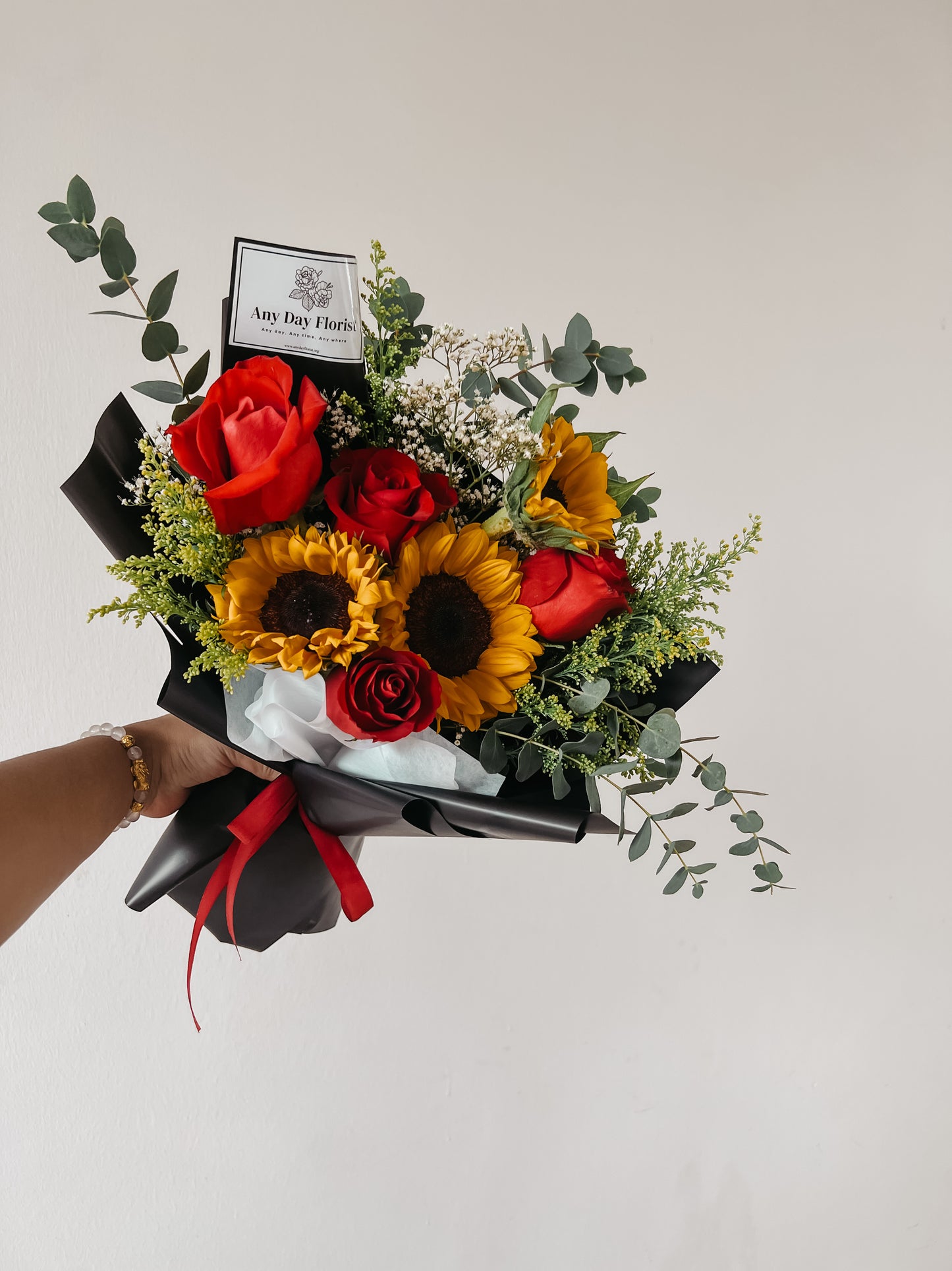 Any Day Florist
The best way to find out if a rose is real is to cut it  Rosie loves the sun and flowers, so she put them together in this beautiful Sunflower Rose Bouquet. She hanSunflower Rosie | Sunflower Roses Bouquet