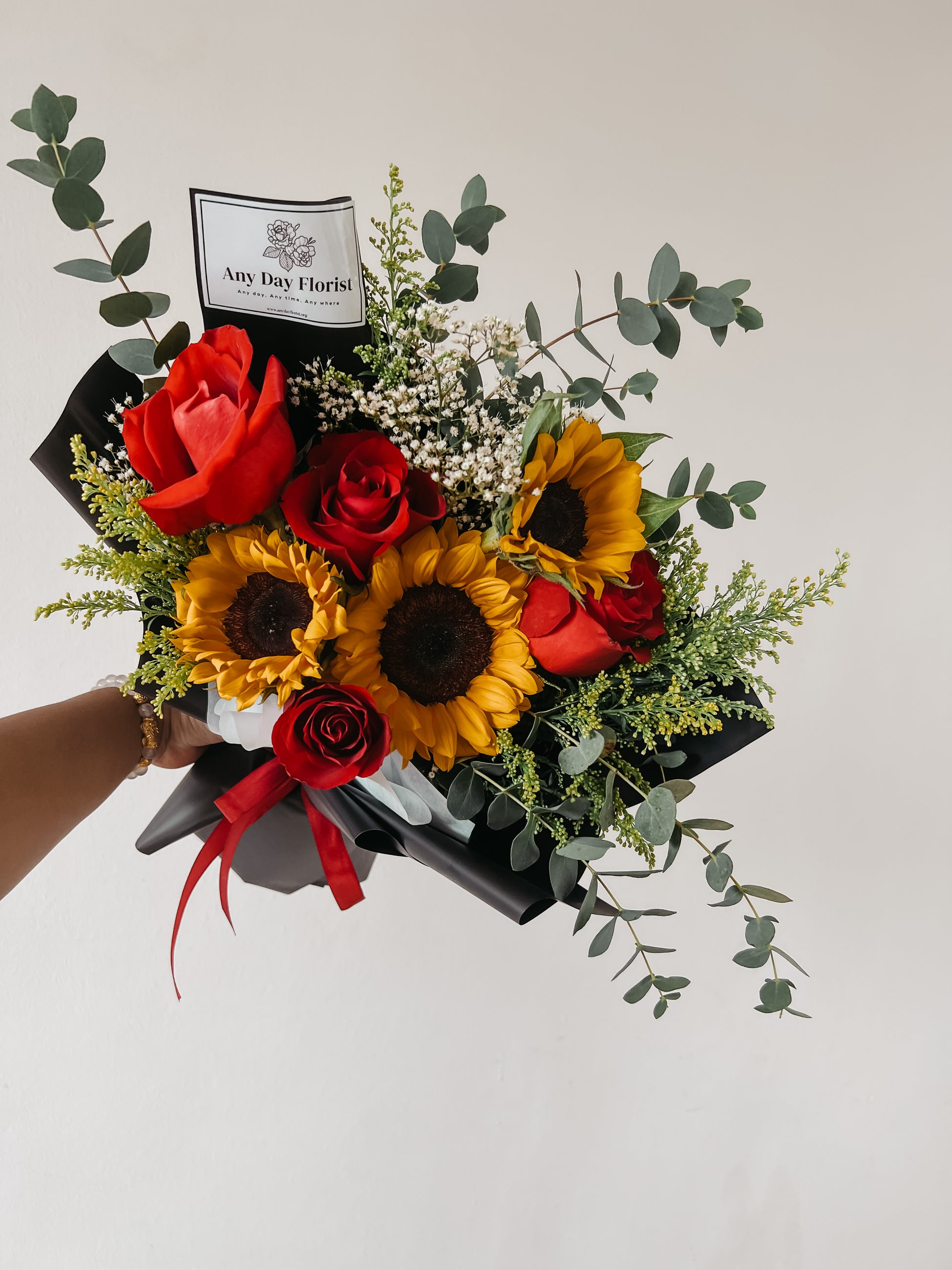Any Day Florist
The best way to find out if a rose is real is to cut it  Rosie loves the sun and flowers, so she put them together in this beautiful Sunflower Rose Bouquet. She hanSunflower Rosie | Sunflower Roses Bouquet
