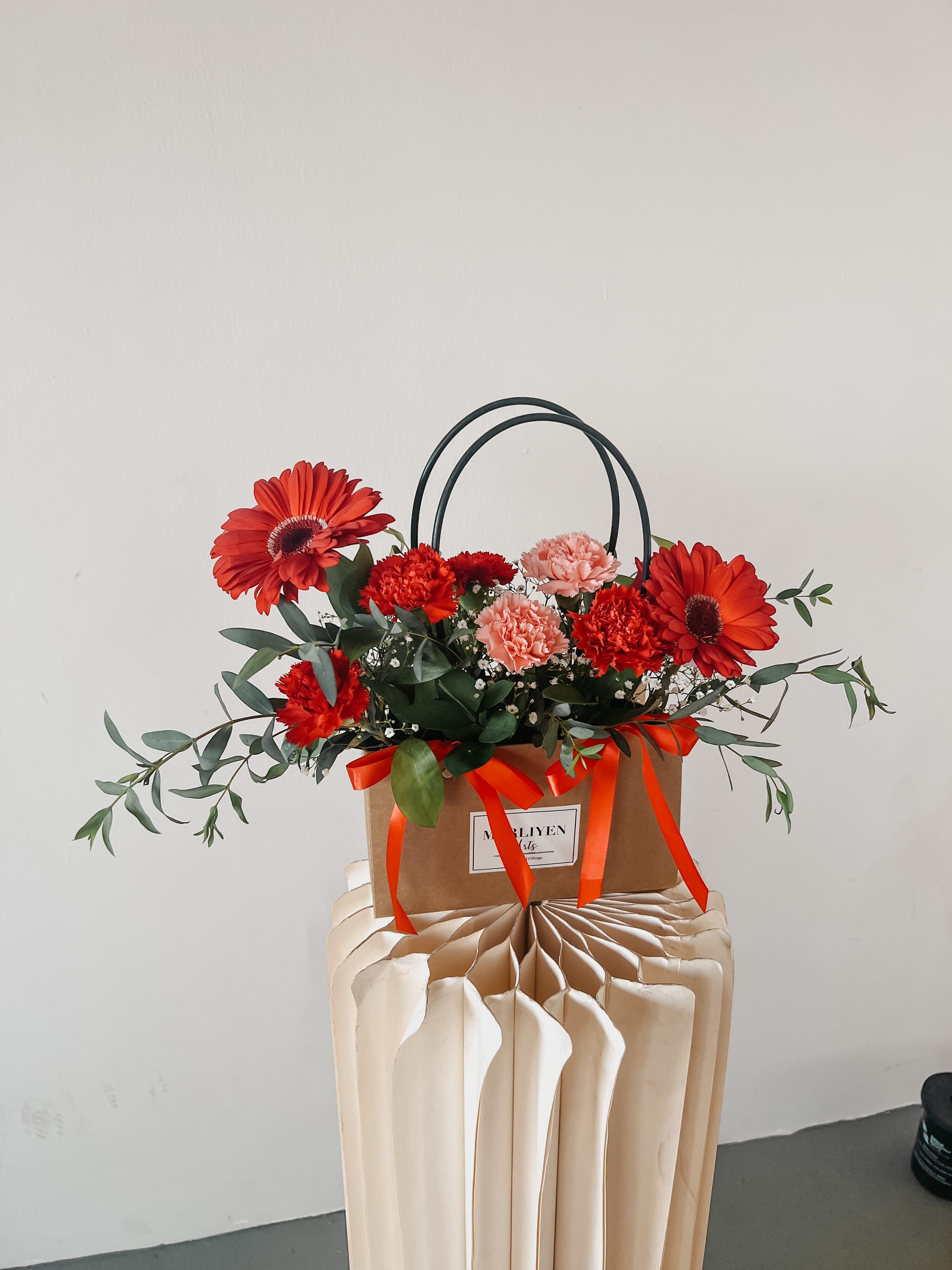 Any Day FloristPerfect gift for all the mommys out there as this bloom bag consists of carnations and gebera! Perfect gift for new mothers, motherly figure in your life. Show them A Mother's Love | Bloom Bag Arrangement